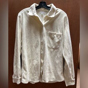 Button missing from left sleeve, color more like Ivory